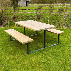 Bespoke outdoor reclaimed picnic table & bench set on the grass.